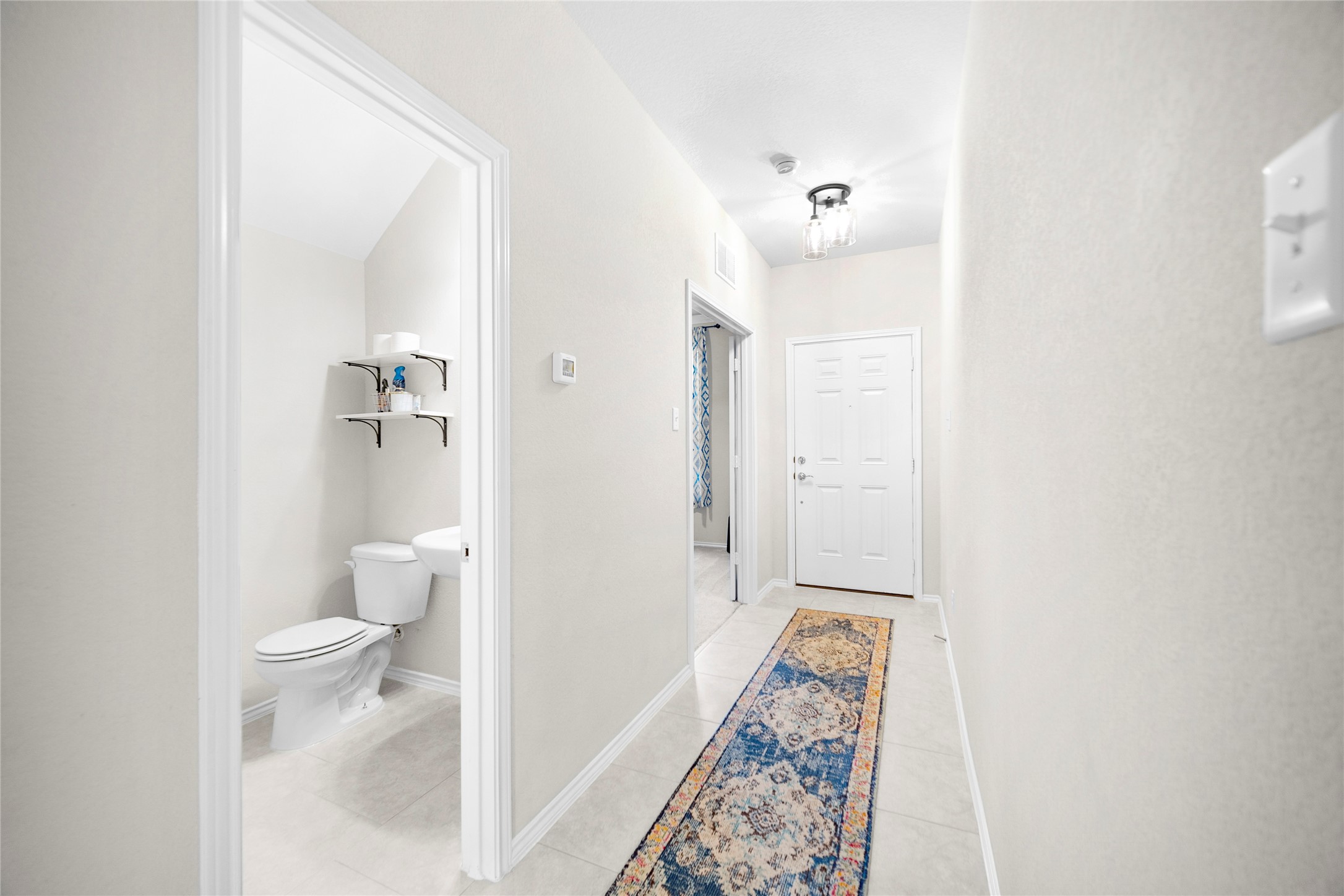 263 Beechnut Drive Buda, TX 78610 - Photo 15 of 40 Entry Hallway / Guest Bath