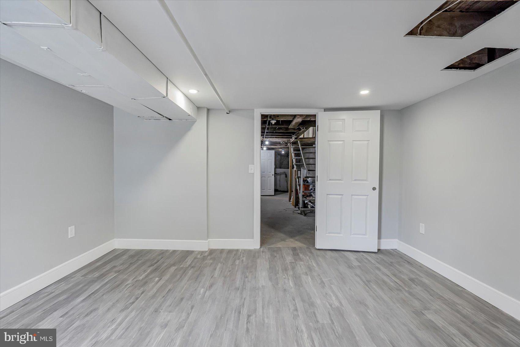 1607 Filbert Street Curtis Bay, MD 21226 - Photo 17 of 33 a view of empty room with wooden floor