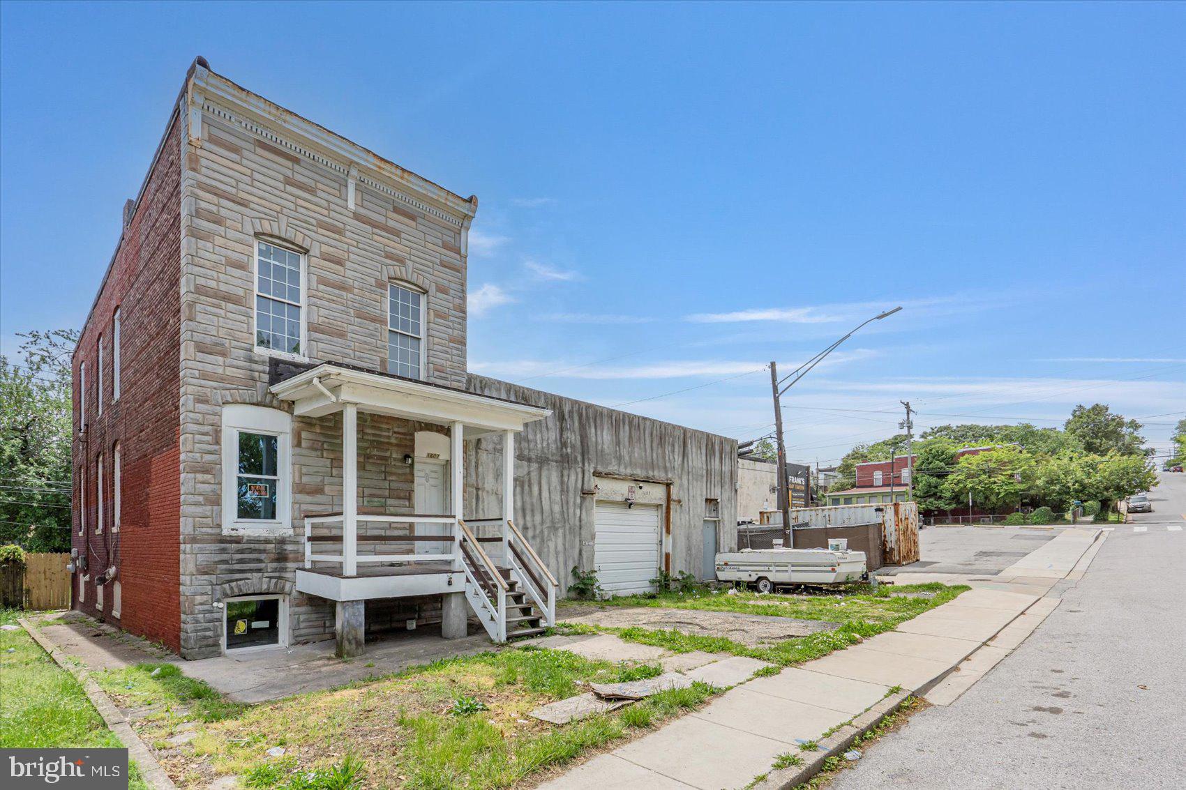 1607 Filbert Street Curtis Bay, MD 21226 - Photo 2 of 33 a front view of a house with garden