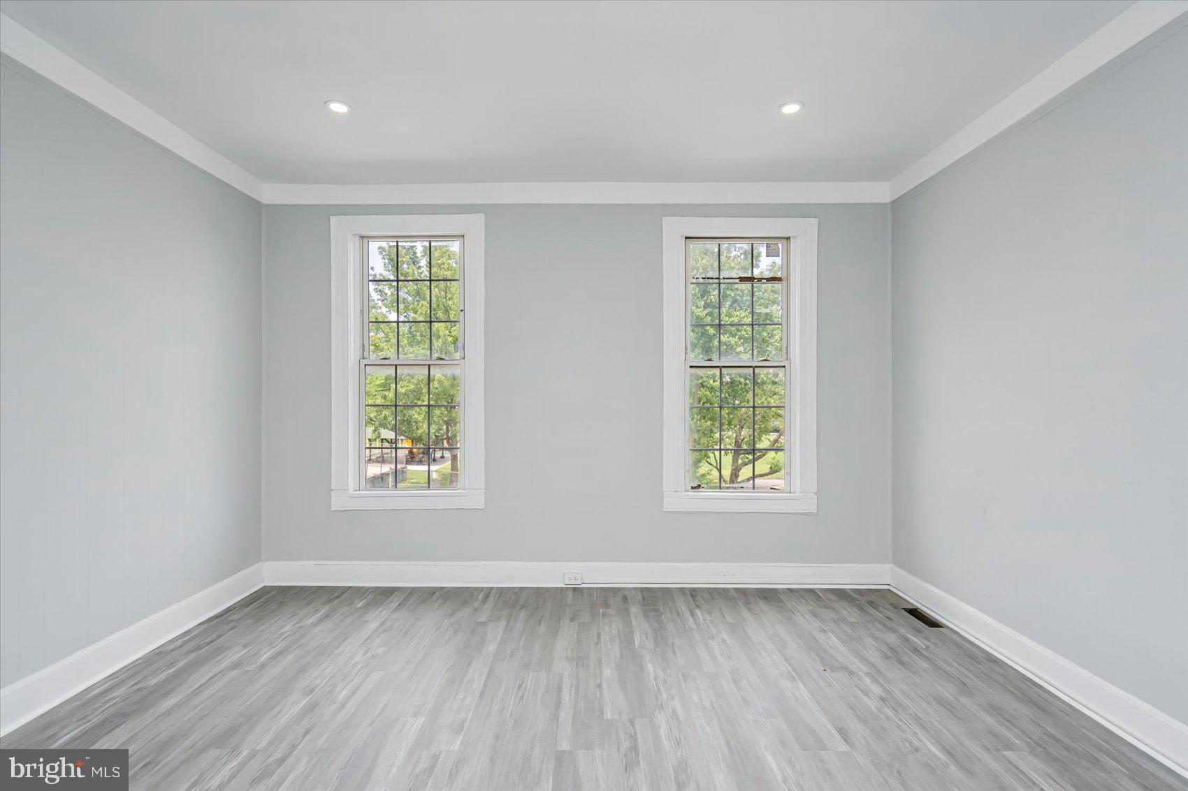 1607 Filbert Street Curtis Bay, MD 21226 - Photo 21 of 33 a view of an empty room with wooden floor and window
