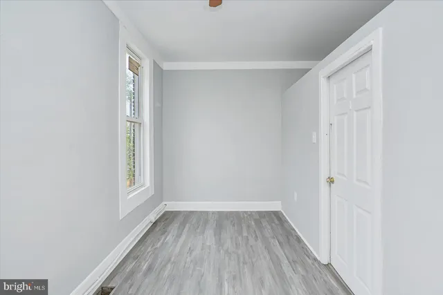 a view of room with window and hardwood floor