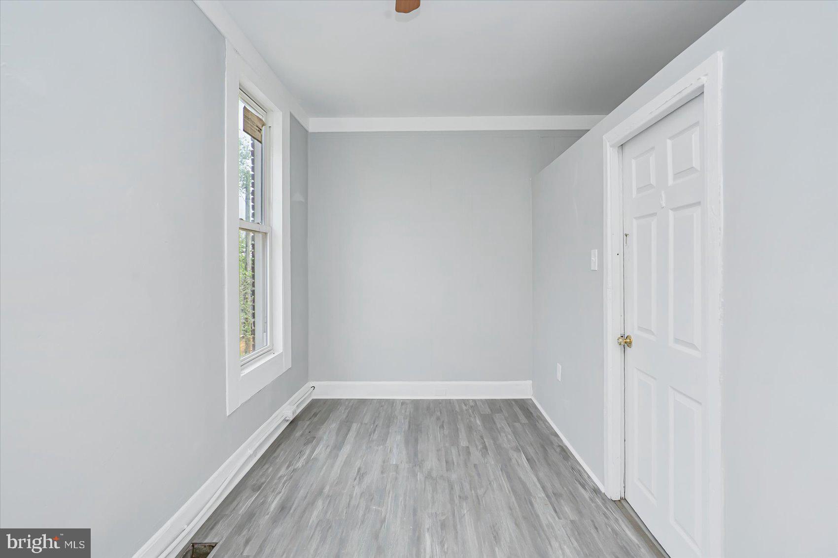 1607 Filbert Street Curtis Bay, MD 21226 - Photo 23 of 33 a view of room with window and hardwood floor