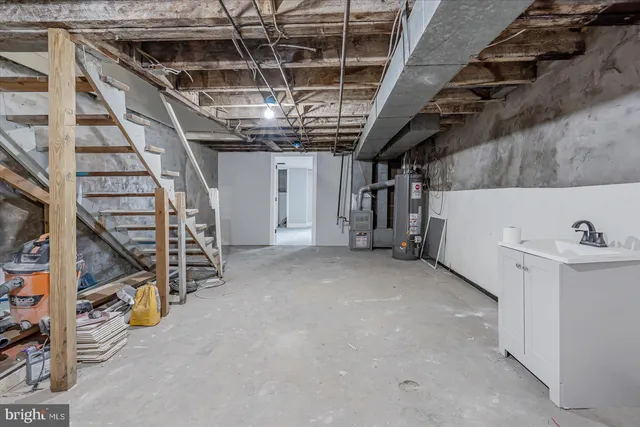 a view of an empty room with stairs