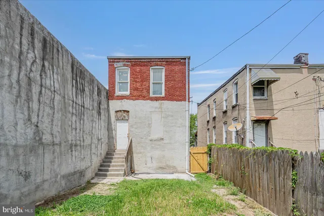 a front view of a house with brick walls
