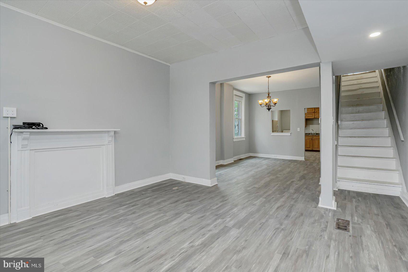1607 Filbert Street Curtis Bay, MD 21226 - Photo 4 of 33 wooden floor in an empty room