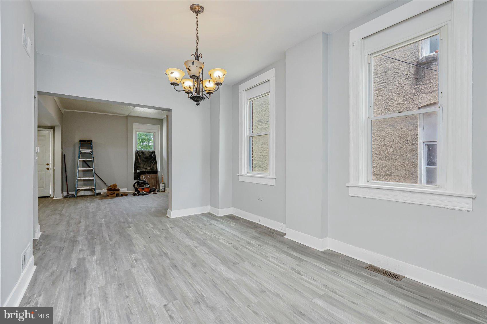 1607 Filbert Street Curtis Bay, MD 21226 - Photo 10 of 33 a view of a room with wooden floor and chandelier