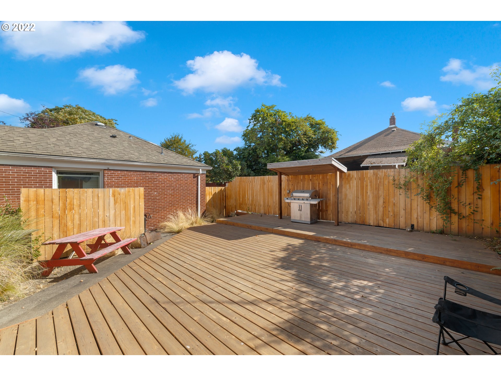 506 Northeast Rosa Parks Way, Unit 2 Portland, OR 97211 - Photo 11 of 17 a view of a backyard with sitting area