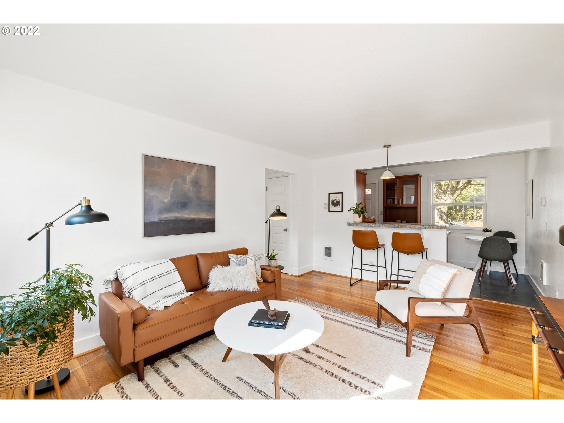 506 Northeast Rosa Parks Way, Unit 2 Portland, OR 97211 - Photo 3 of 17 a living room with furniture and wooden floor