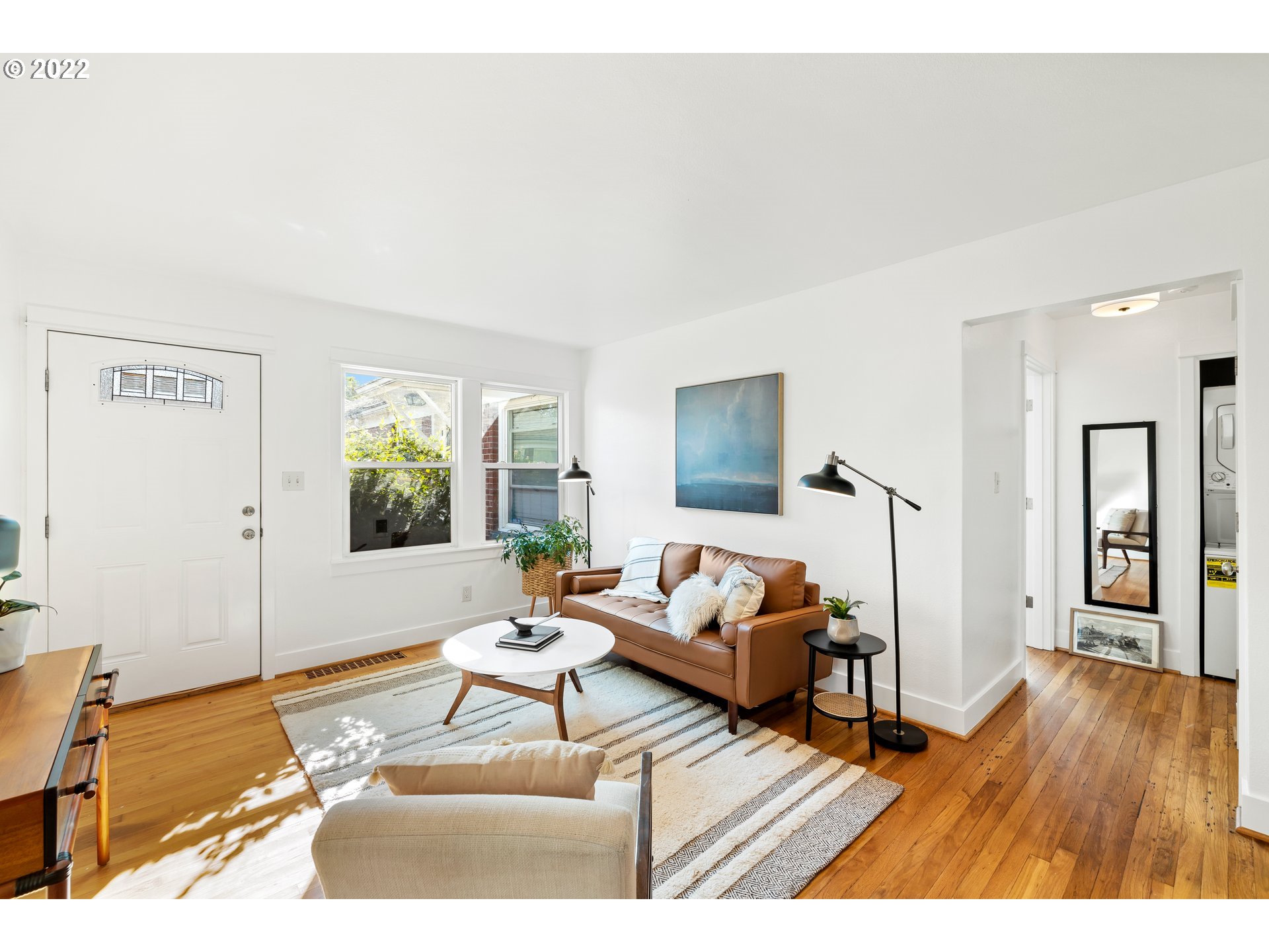 506 Northeast Rosa Parks Way, Unit 2 Portland, OR 97211 - Photo 4 of 17 a living room with furniture and a wooden floor