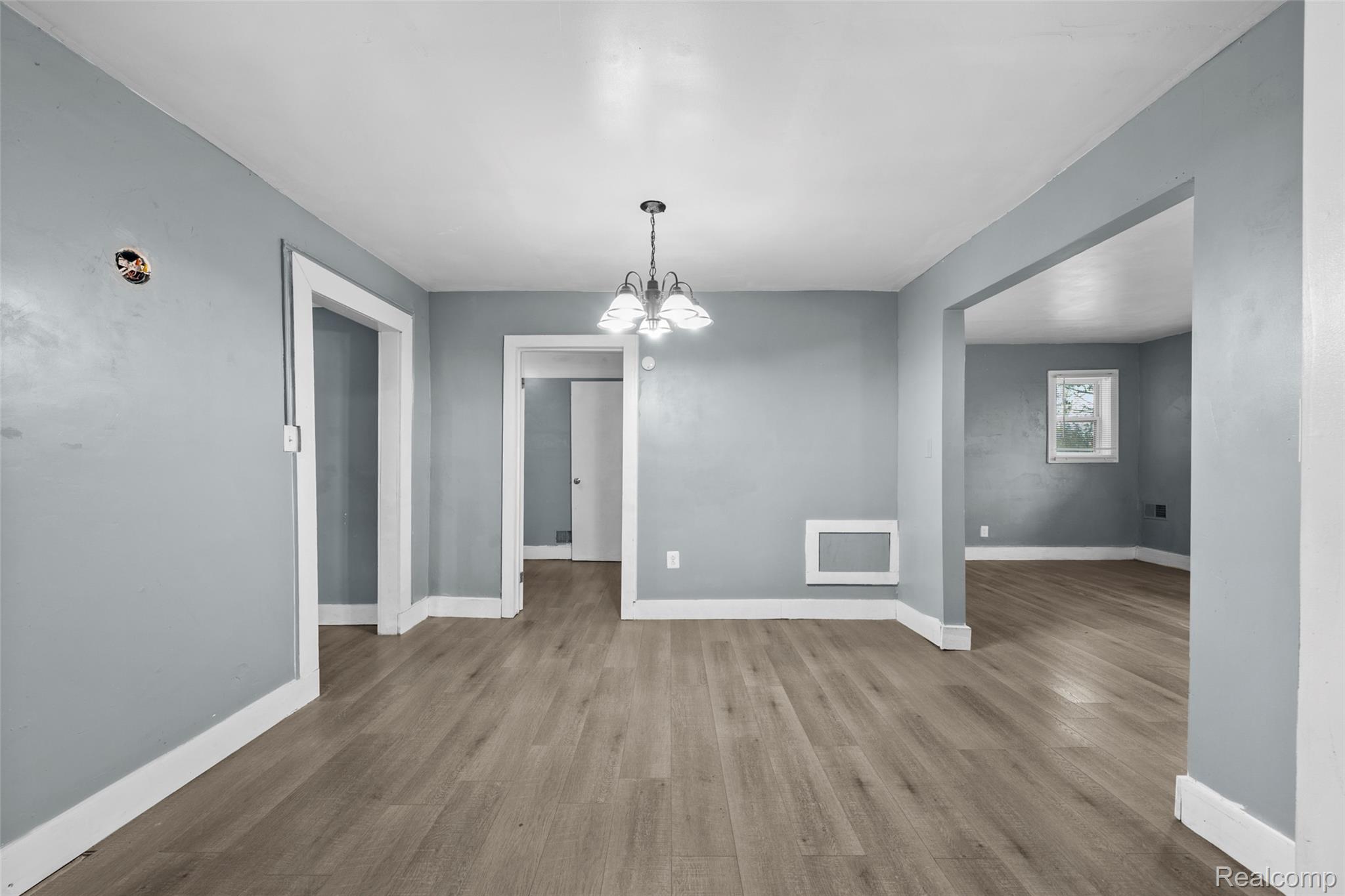 3605 Ash Street Inkster, MI 48141 - Photo 10 of 25 Unfurnished dining area featuring suspended lighting and wood finished floors