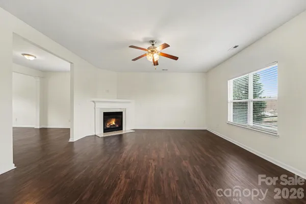a view of a room window and wooden floor