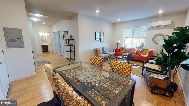 a living room with furniture and a table