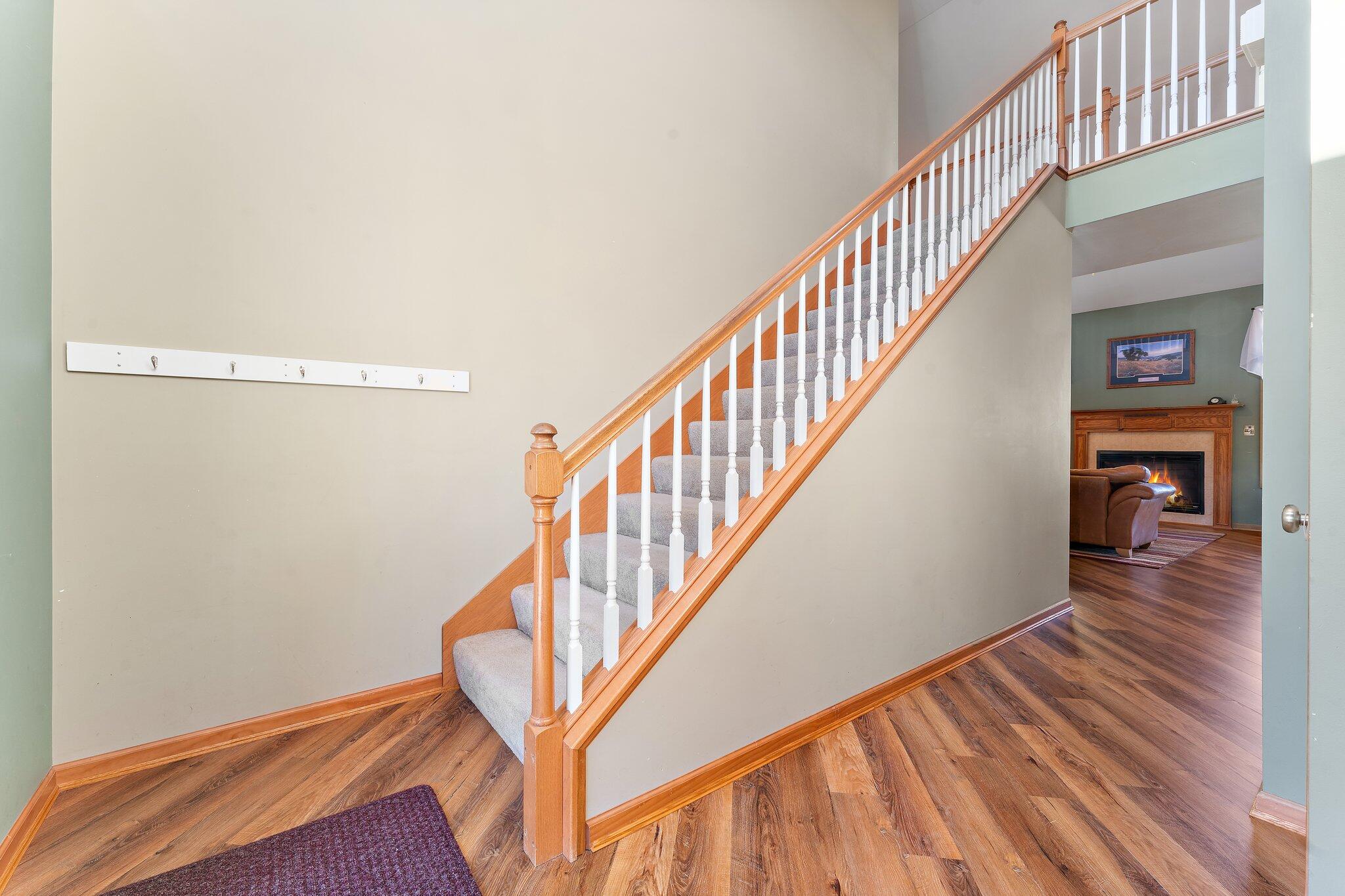 1636 Edith Way Crown Point, IN 46307 - Photo 11 of 56 a view of a hallway with wooden floor and staircase