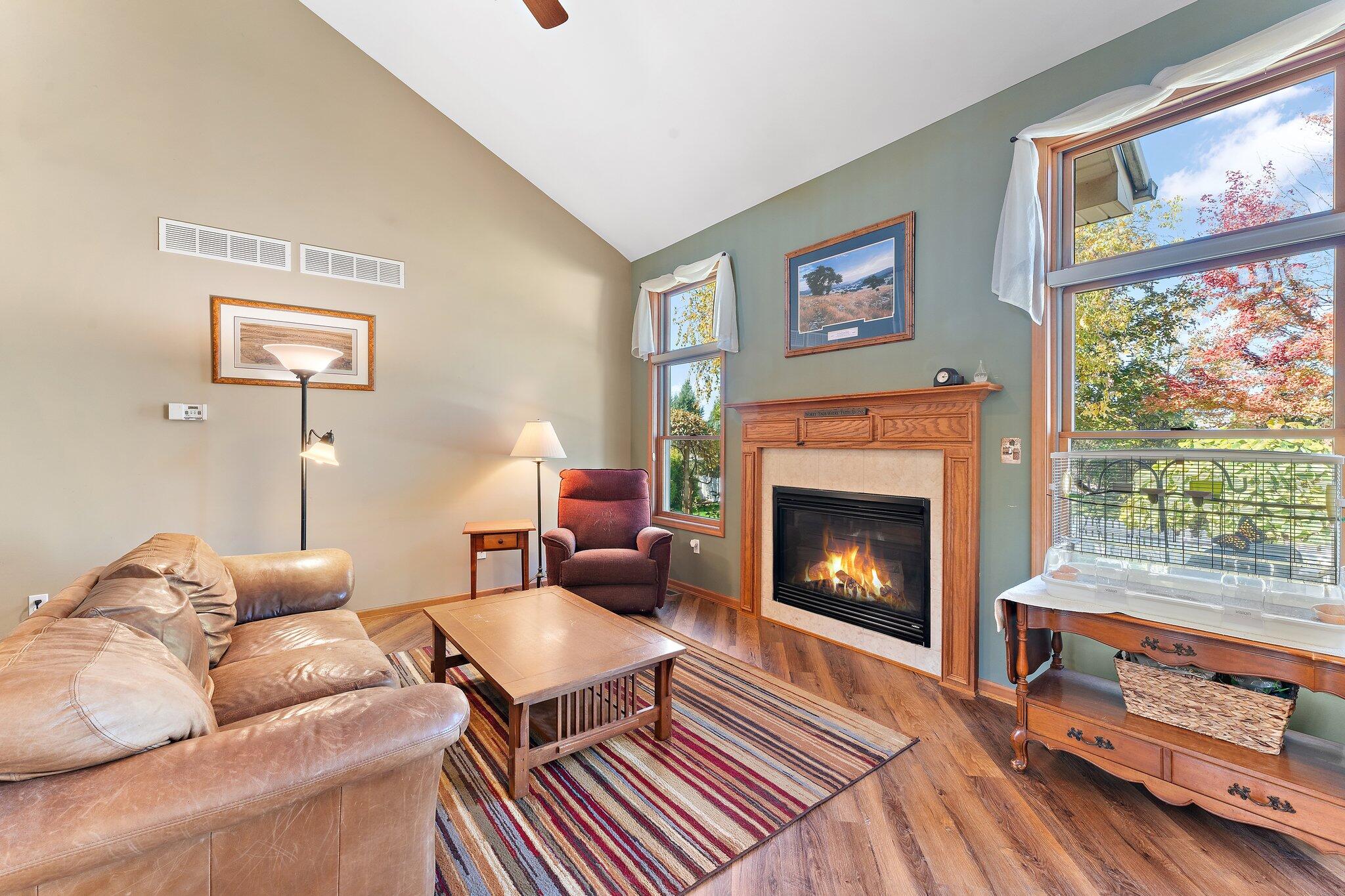 1636 Edith Way Crown Point, IN 46307 - Photo 13 of 56 a living room with furniture a fireplace and a large window