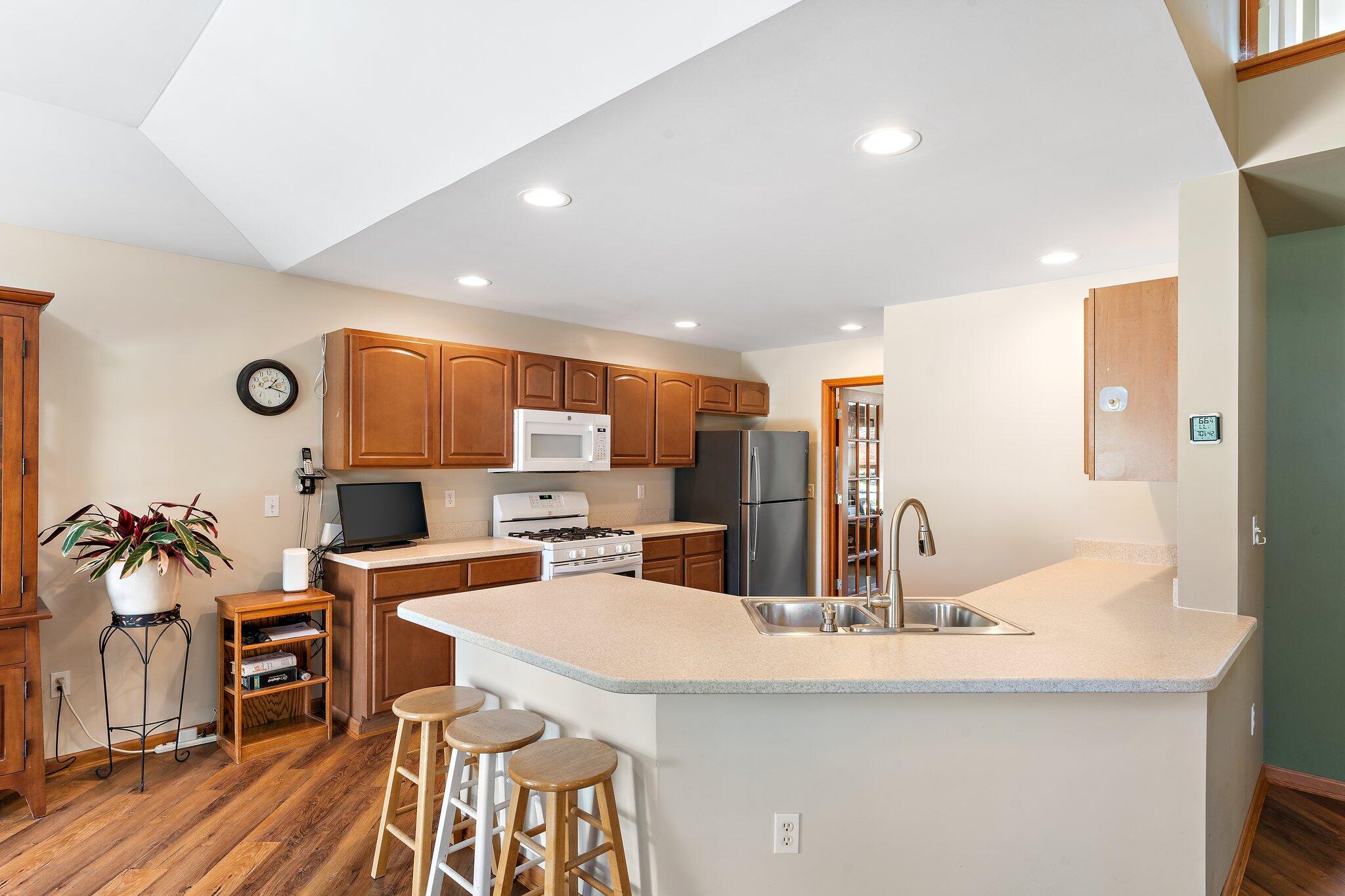 1636 Edith Way Crown Point, IN 46307 - Photo 17 of 56 a kitchen with stainless steel appliances kitchen island granite countertop a sink and cabinets