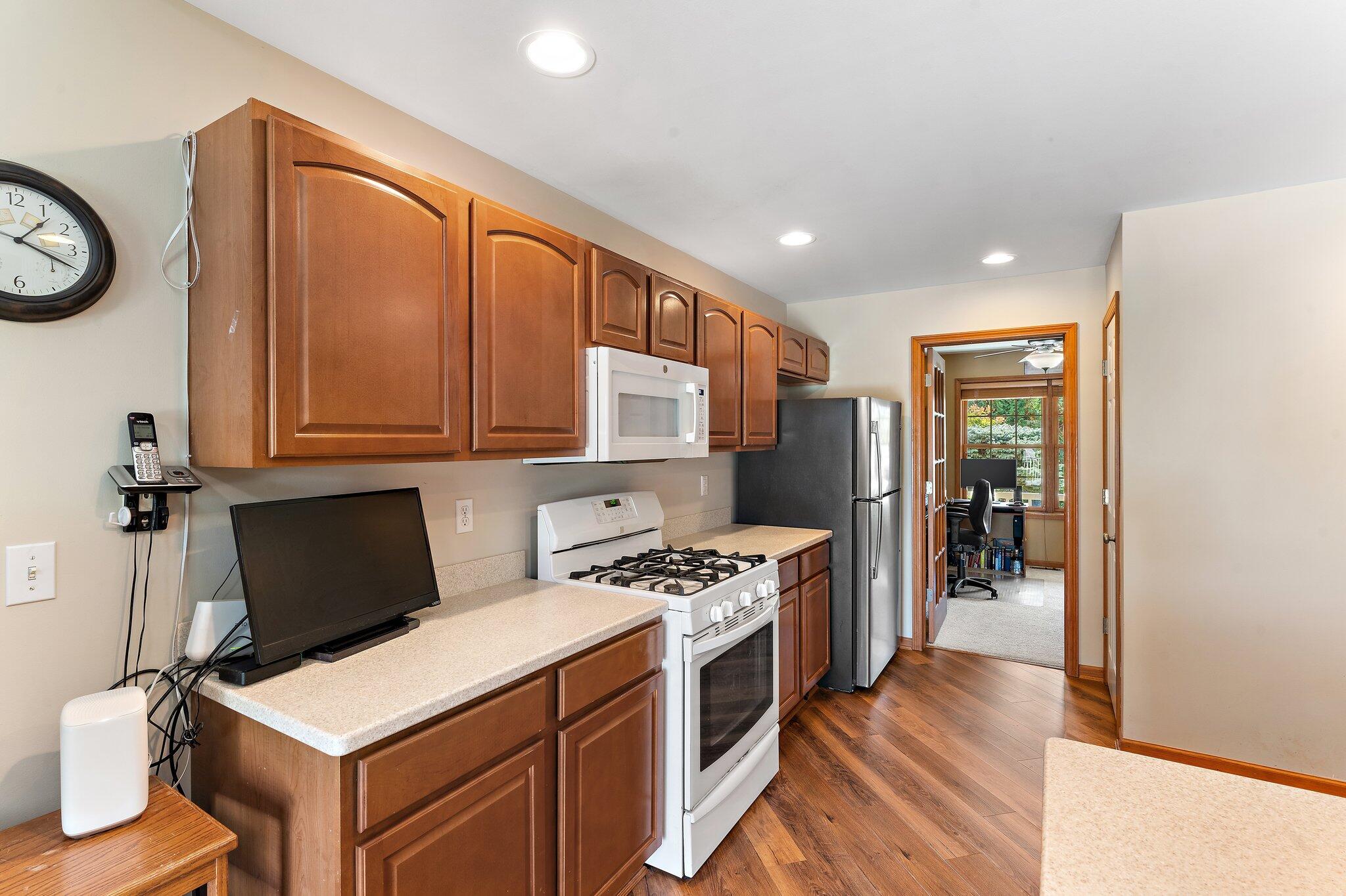 1636 Edith Way Crown Point, IN 46307 - Photo 20 of 56 a kitchen that has a stove and a refrigerator