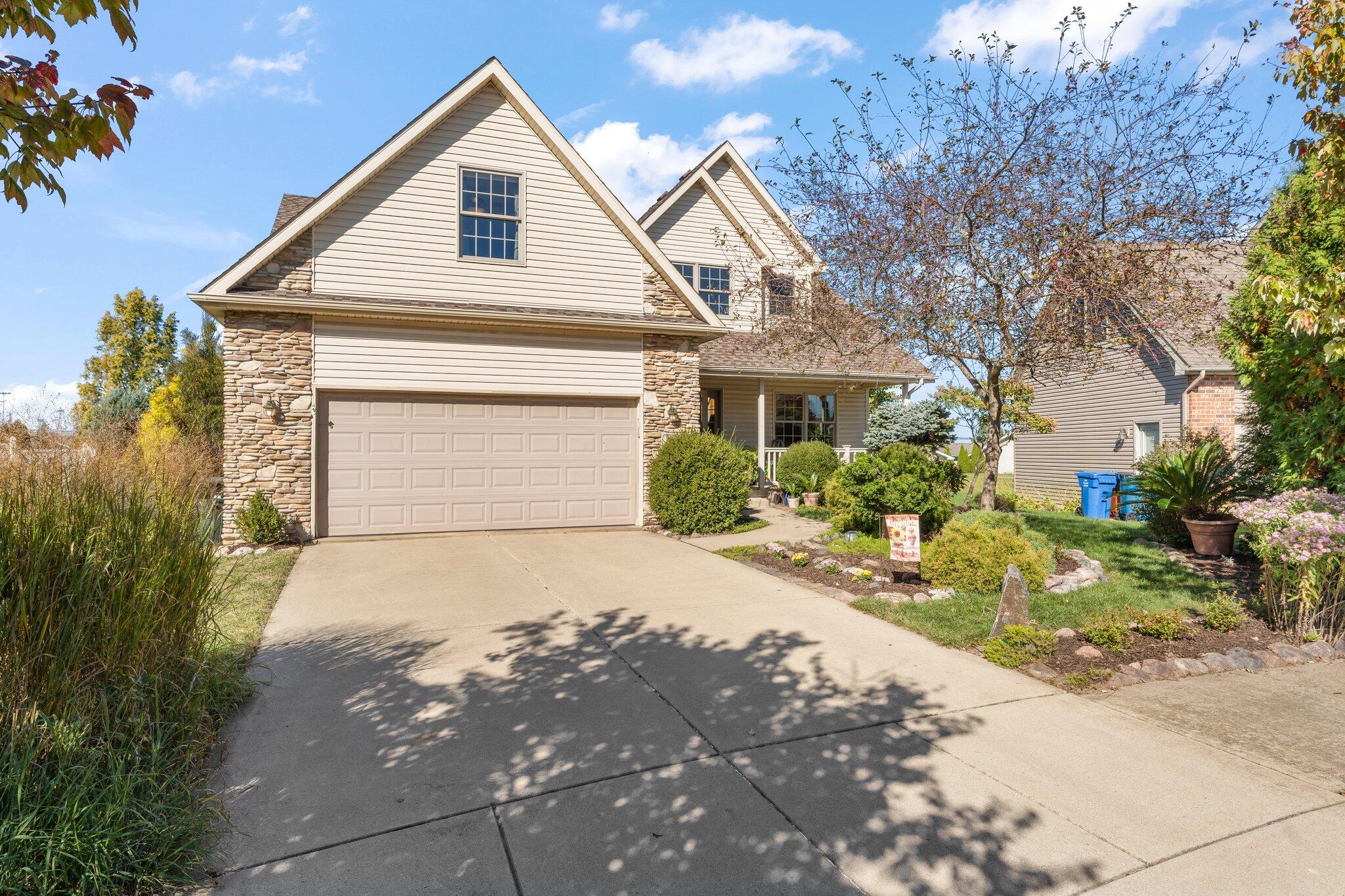 1636 Edith Way Crown Point, IN 46307 - Photo 2 of 56 a front view of a house with a yard and garage