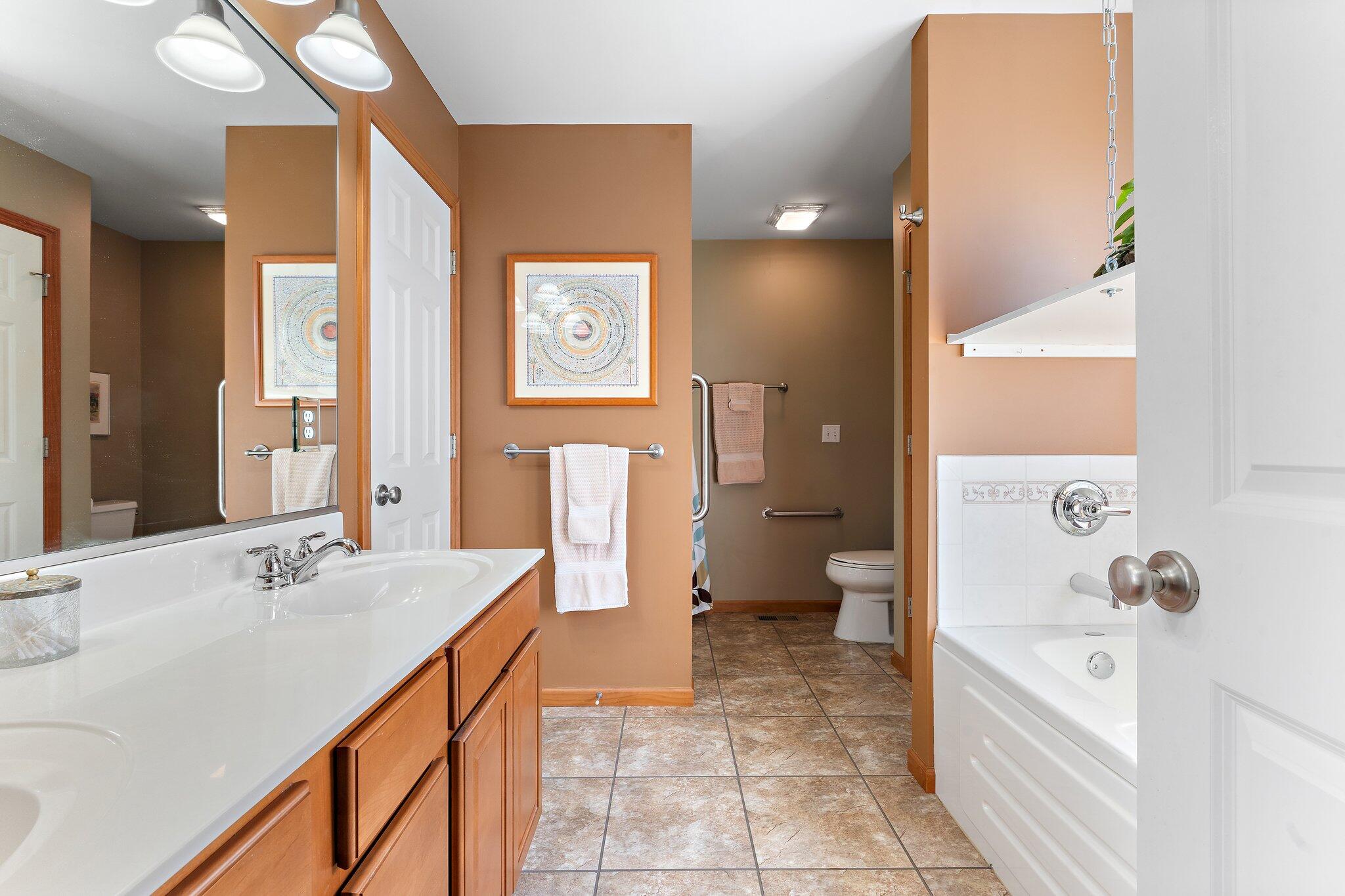 1636 Edith Way Crown Point, IN 46307 - Photo 25 of 56 a spacious bathroom with a bathtub sink and toilet
