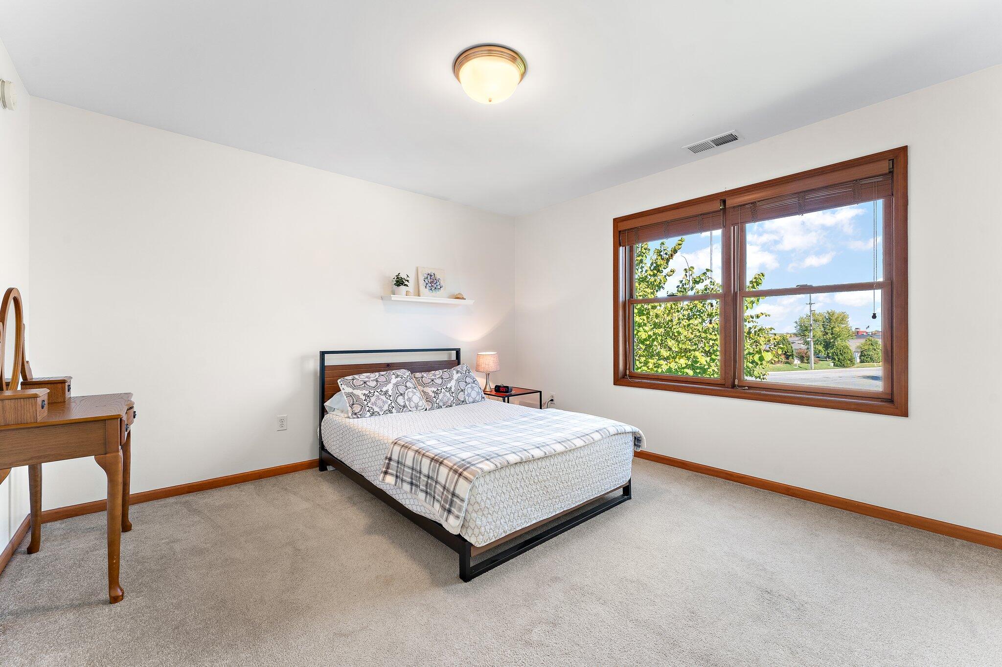 1636 Edith Way Crown Point, IN 46307 - Photo 32 of 56 a bedroom with a bed and window