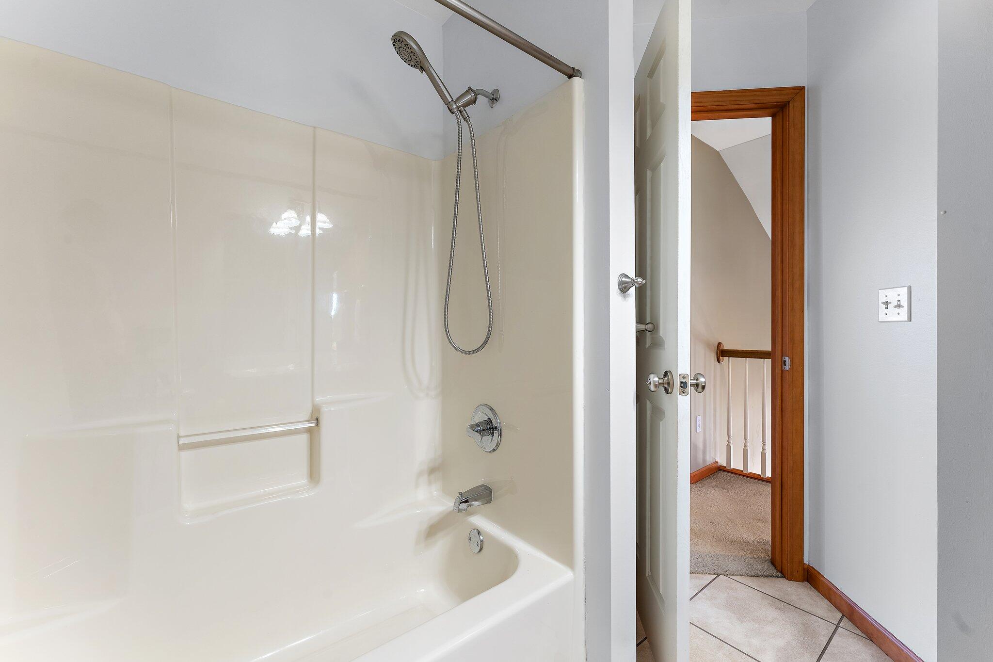 1636 Edith Way Crown Point, IN 46307 - Photo 35 of 56 a bathroom with a bathtub and a shower