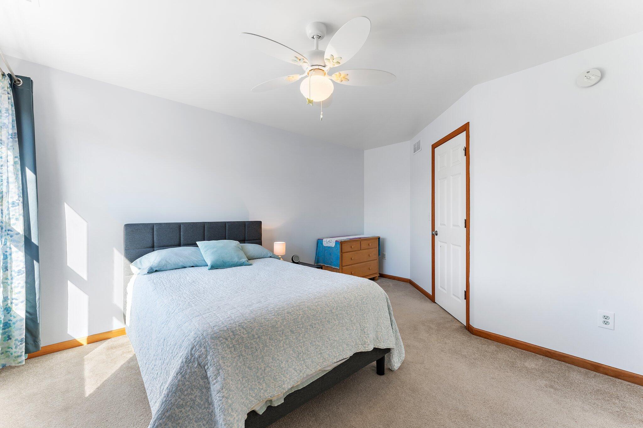 1636 Edith Way Crown Point, IN 46307 - Photo 37 of 56 a bedroom with a bed and a chandelier