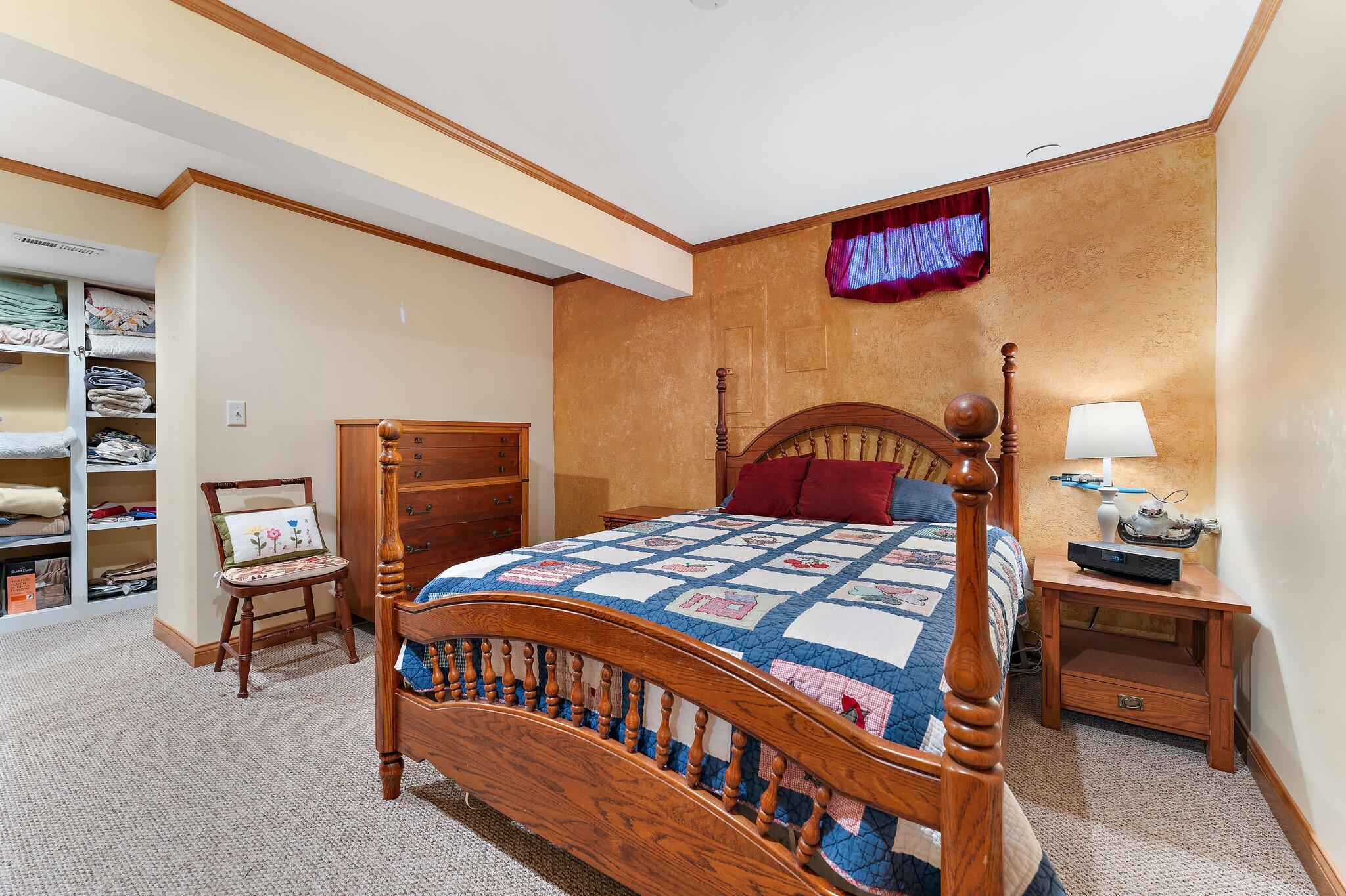 1636 Edith Way Crown Point, IN 46307 - Photo 39 of 56 a bedroom with a bed and a dresser in it