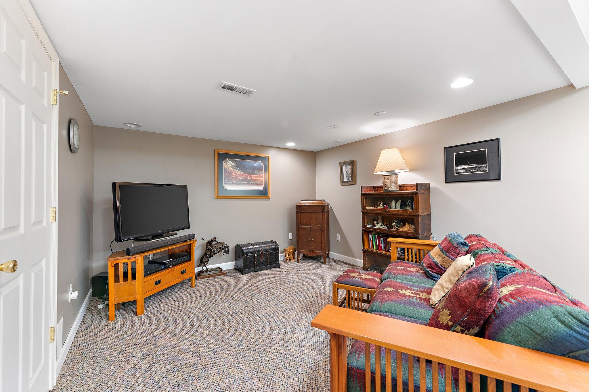 1636 Edith Way Crown Point, IN 46307 - Photo 41 of 56 a living room with furniture and a flat screen tv