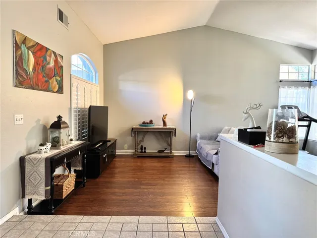 a kitchen with stainless steel appliances a stove top oven a sink a counter top space and cabinets