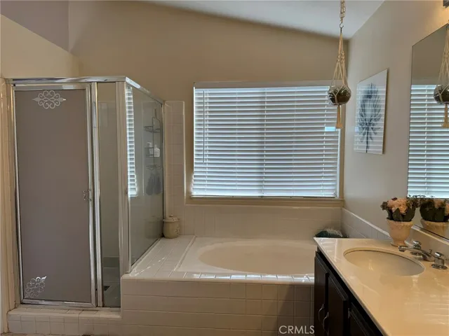 a bathroom with a tub and a sink