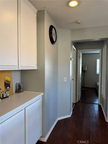 a view of a kitchen from the hallway