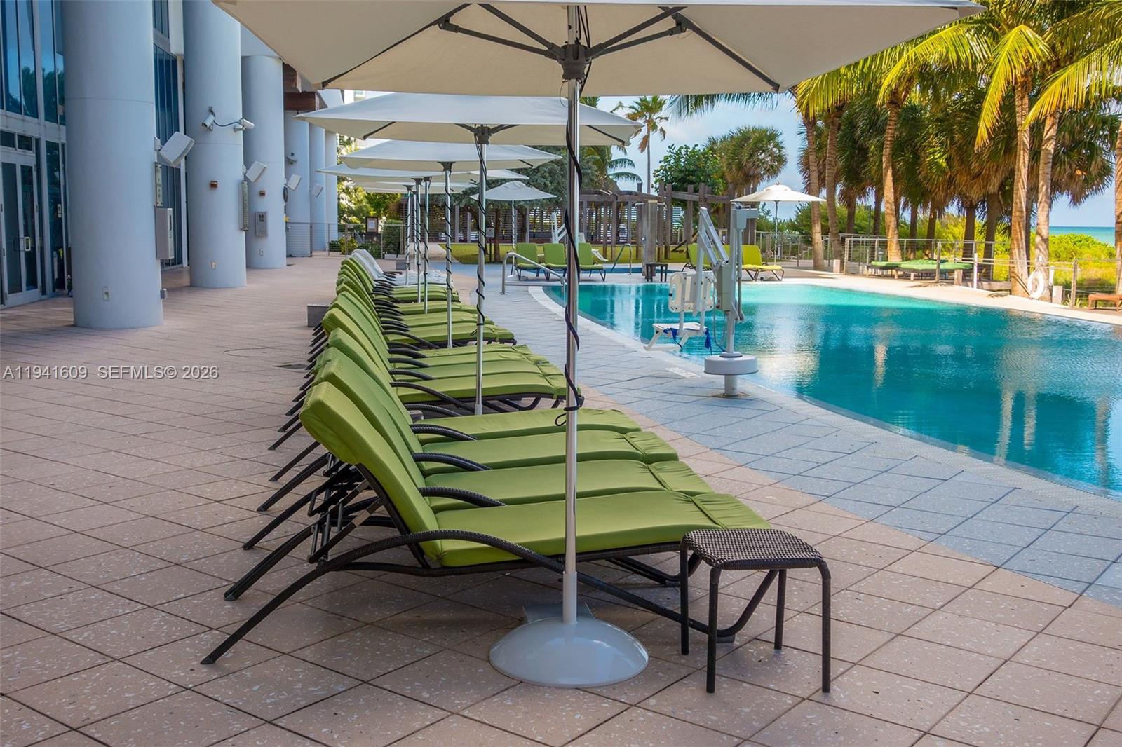 6899 Collins Avenue, Unit 1205 Miami Beach, FL 33141 - Photo 36 of 48 a view of a chairs and table in the patio