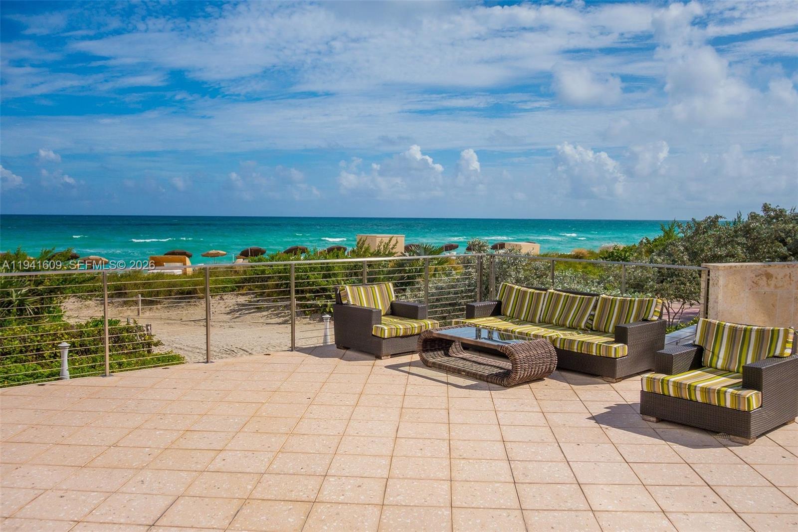 6899 Collins Avenue, Unit 1205 Miami Beach, FL 33141 - Photo 42 of 48 a view of roof deck with chair and table