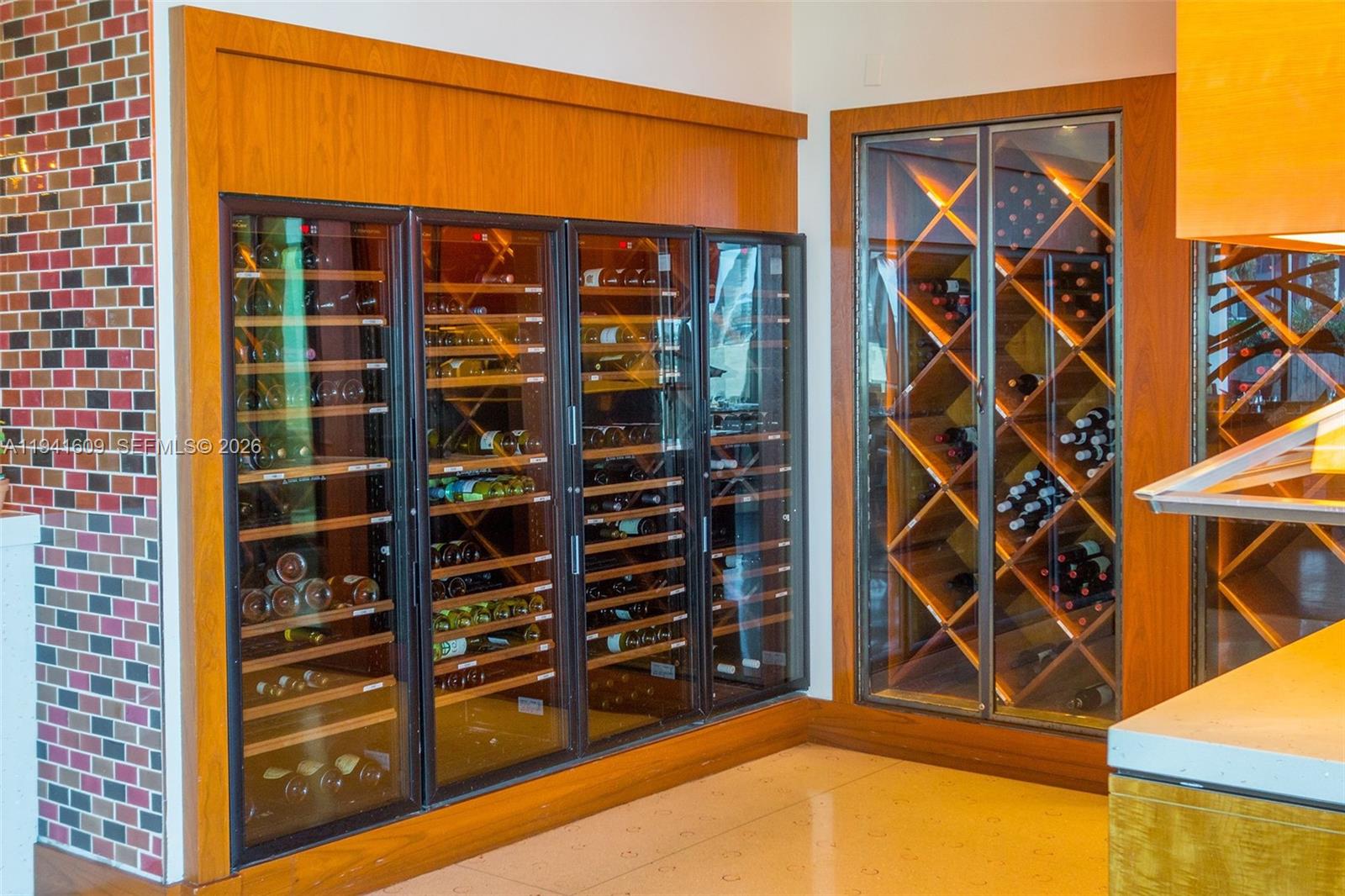 6899 Collins Avenue, Unit 1205 Miami Beach, FL 33141 - Photo 47 of 48 walk in closet with clothes