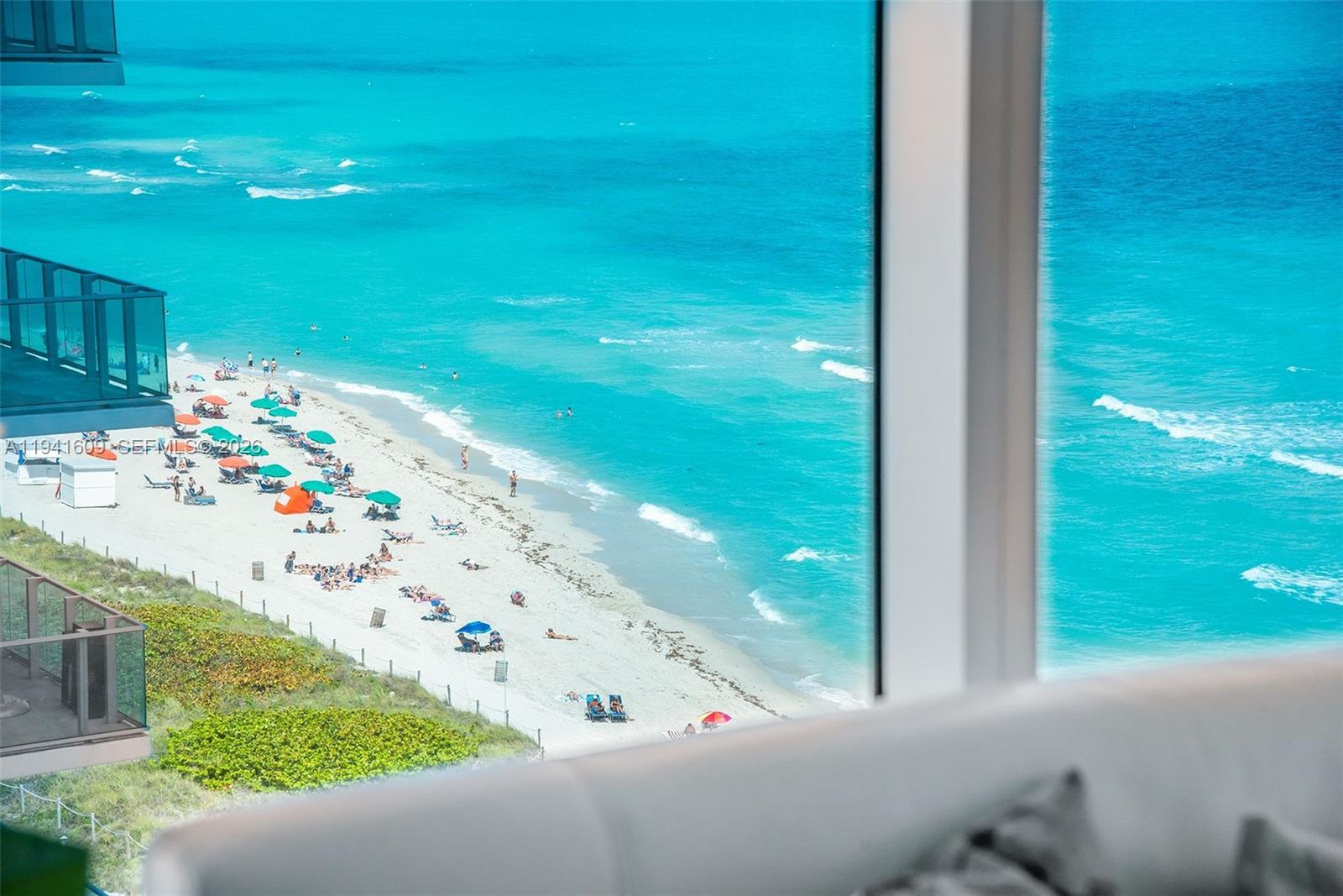 6899 Collins Avenue, Unit 1205 Miami Beach, FL 33141 - Photo 10 of 48 a view of swimming pool from a balcony