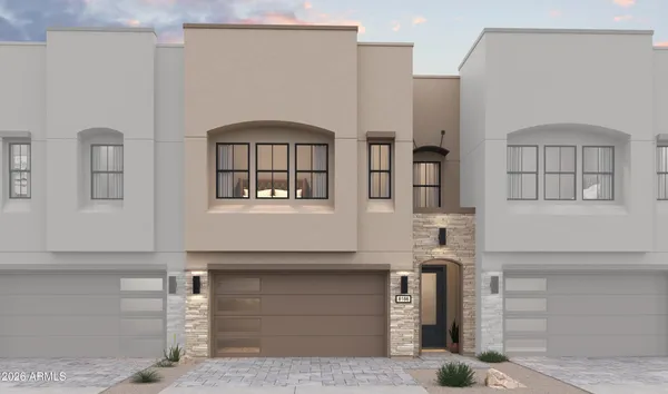 a front view of a house with large windows