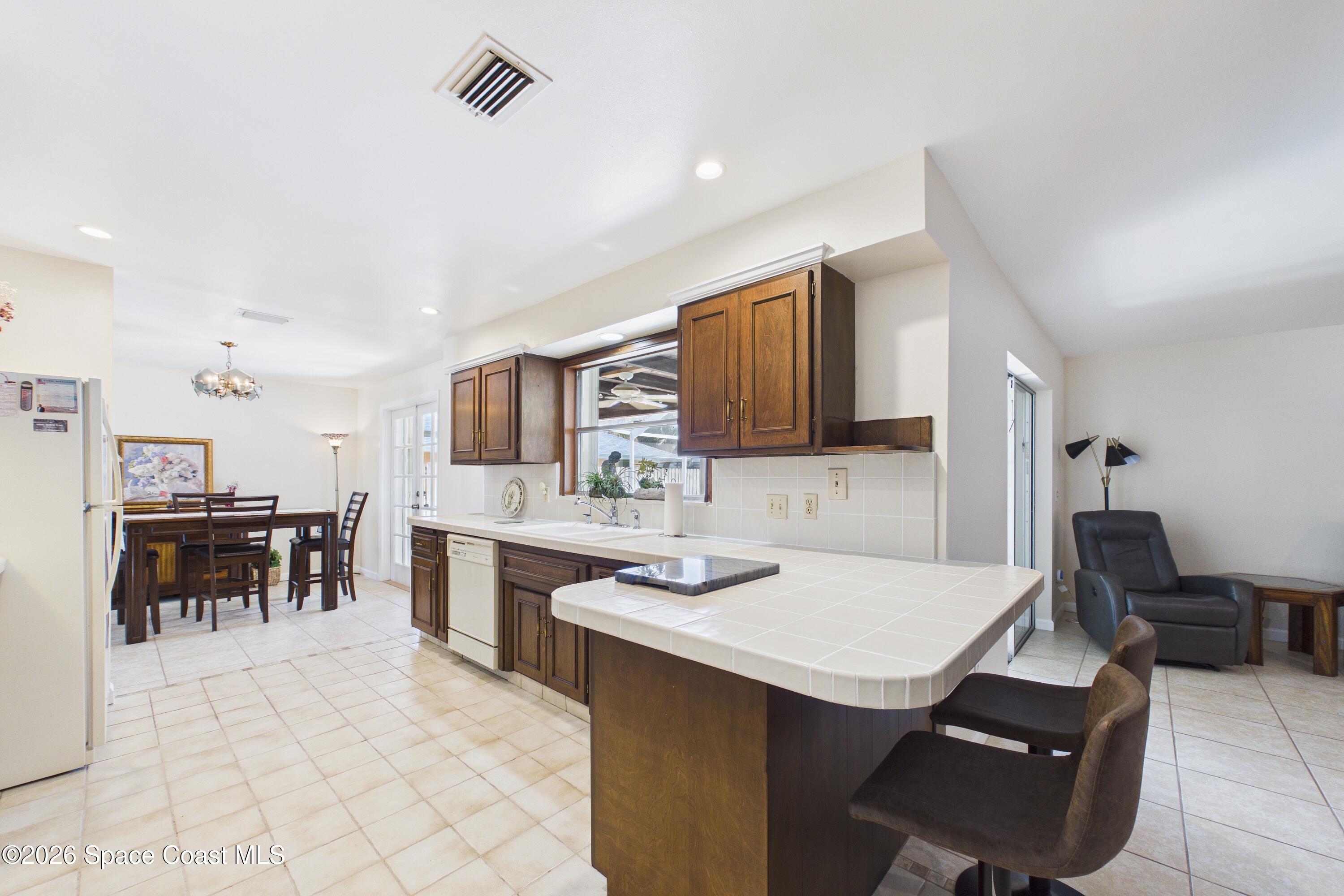 215 Sand Pine Road Indialantic, FL 32903 - Photo 12 of 71 CAM02690G0-PR0233-STILL023_Original