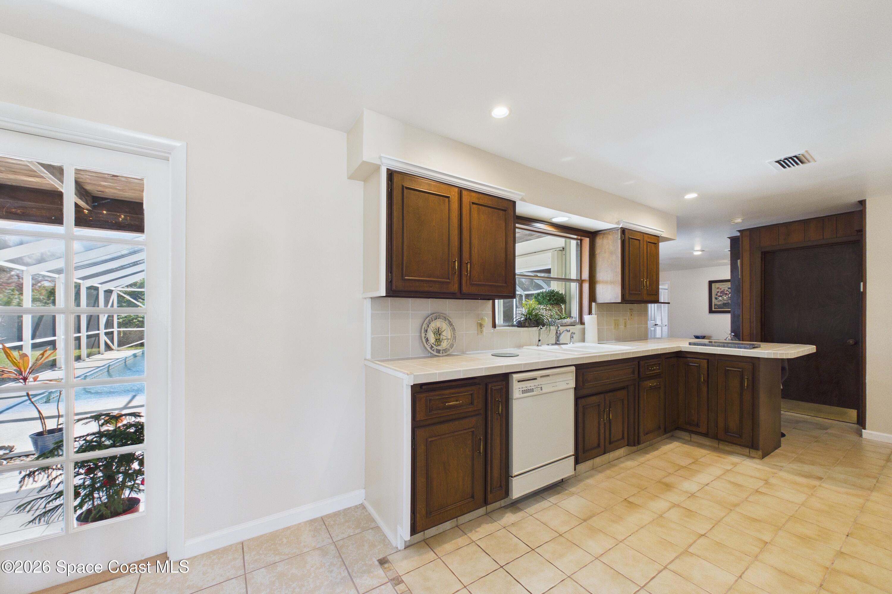 215 Sand Pine Road Indialantic, FL 32903 - Photo 10 of 71 CAM02690G0-PR0233-STILL018_Original