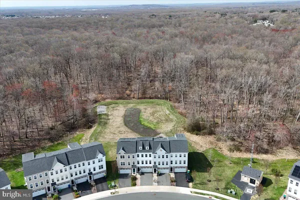 an aerial view of a house with yard garden and patio