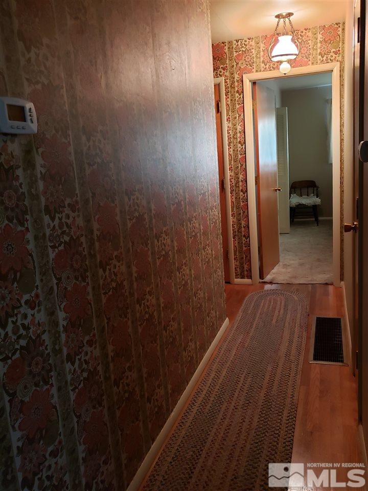 1120 Alpine Circle Reno, NV 89509 - Photo 12 of 21 a view of hallway with wooden floor