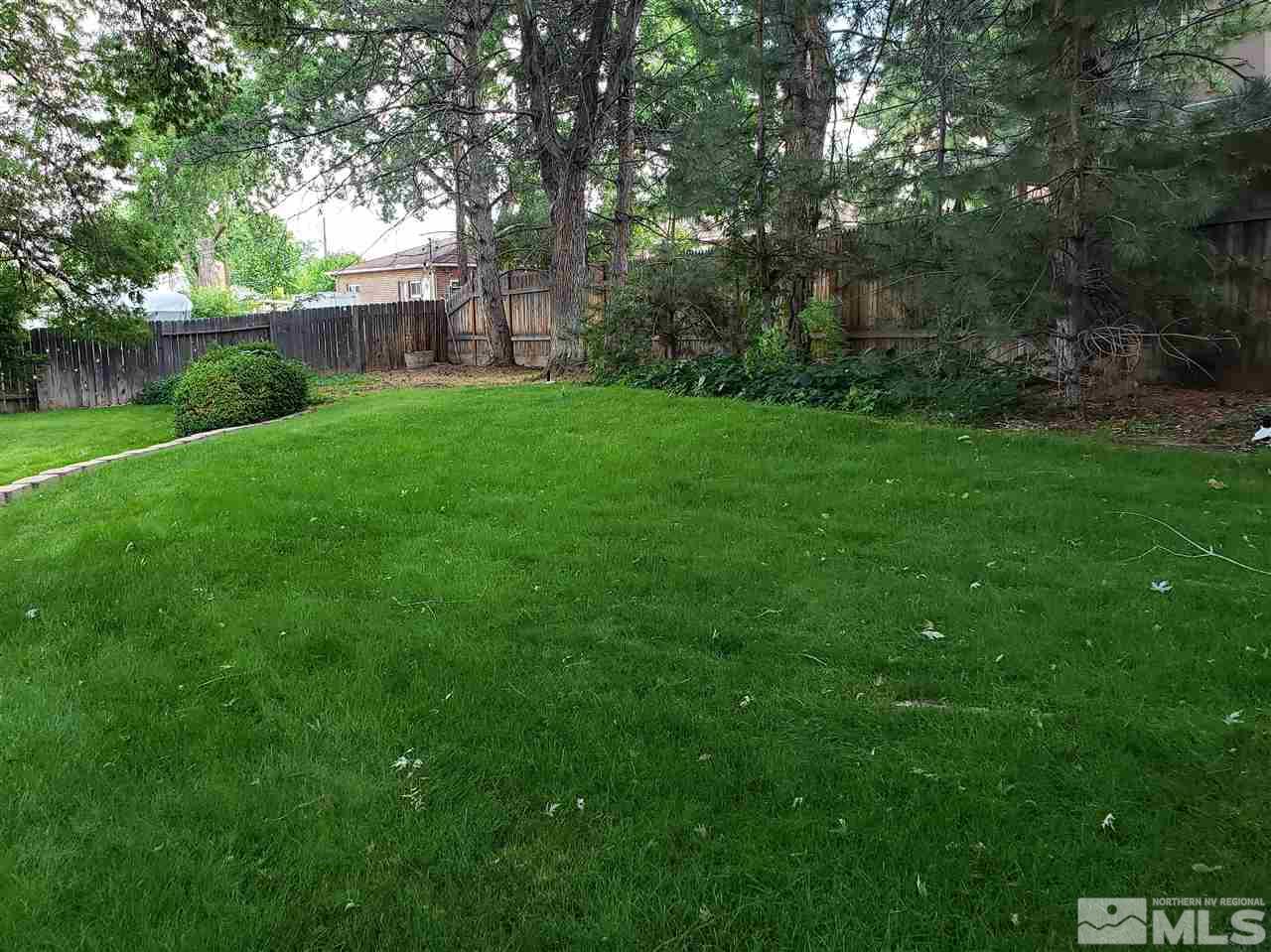 1120 Alpine Circle Reno, NV 89509 - Photo 17 of 21 a view of a backyard with a small cabin