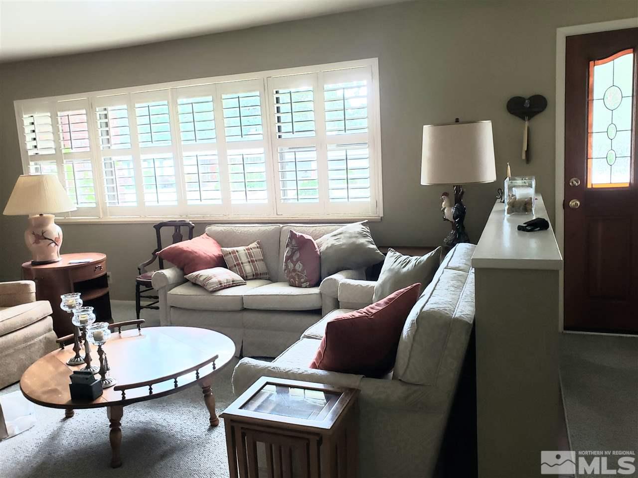 1120 Alpine Circle Reno, NV 89509 - Photo 6 of 21 a living room with furniture and a large window