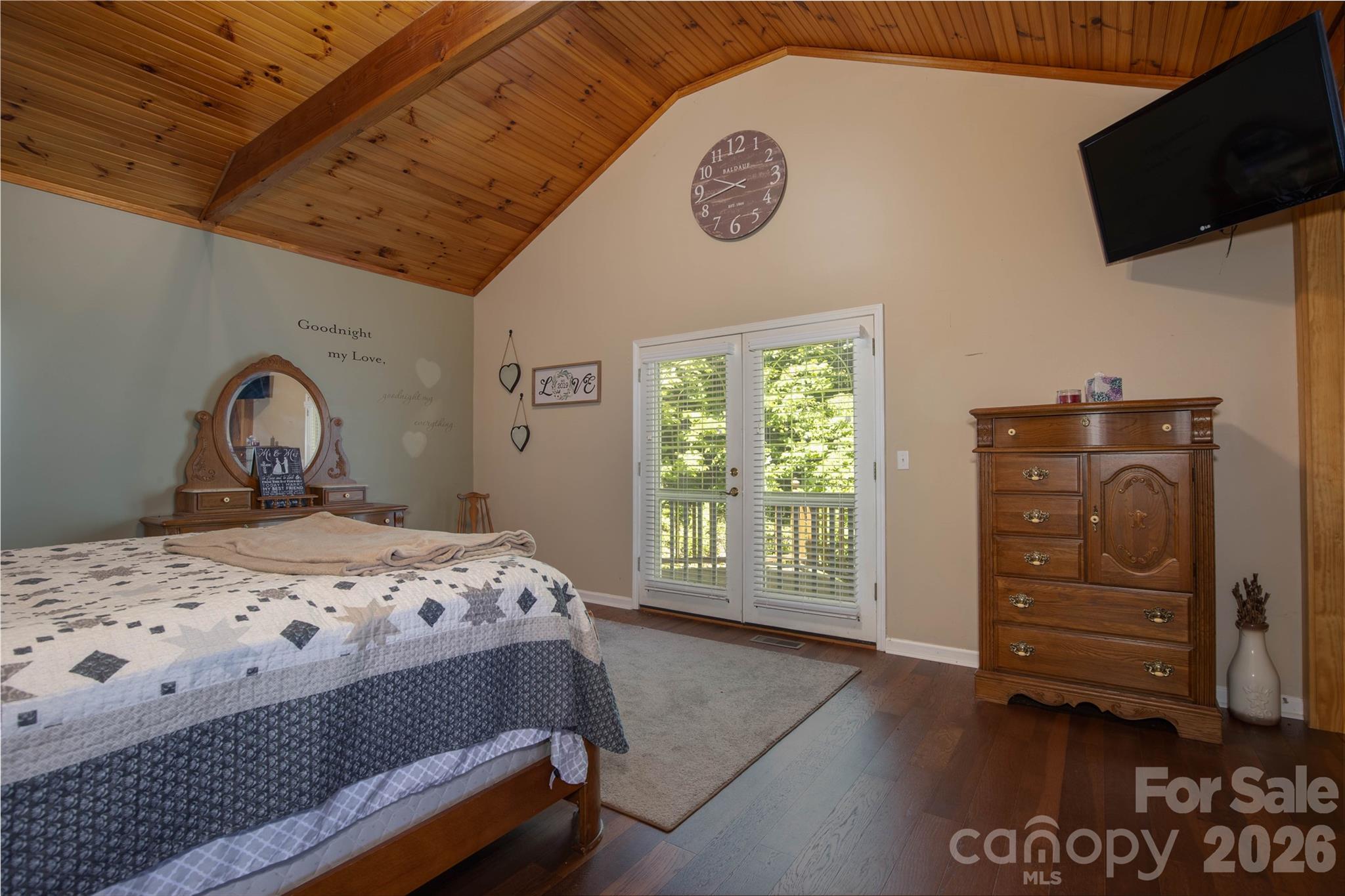 84 Sheets Farm Road Bakersville, NC 28705 - Photo 33 of 42 a bedroom with a bed and a television