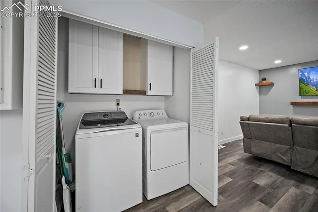 a view of storage and utility room with washer and dryer