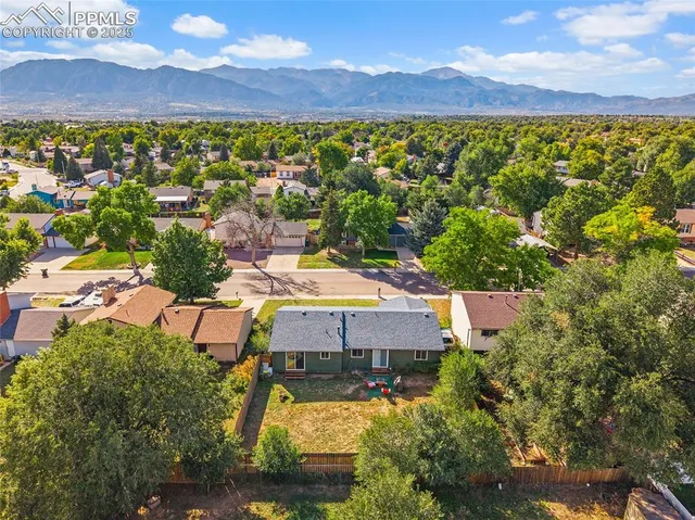 an aerial view of a house with a lake view