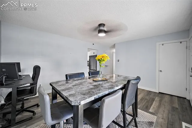 a view of a table and chairs in a room