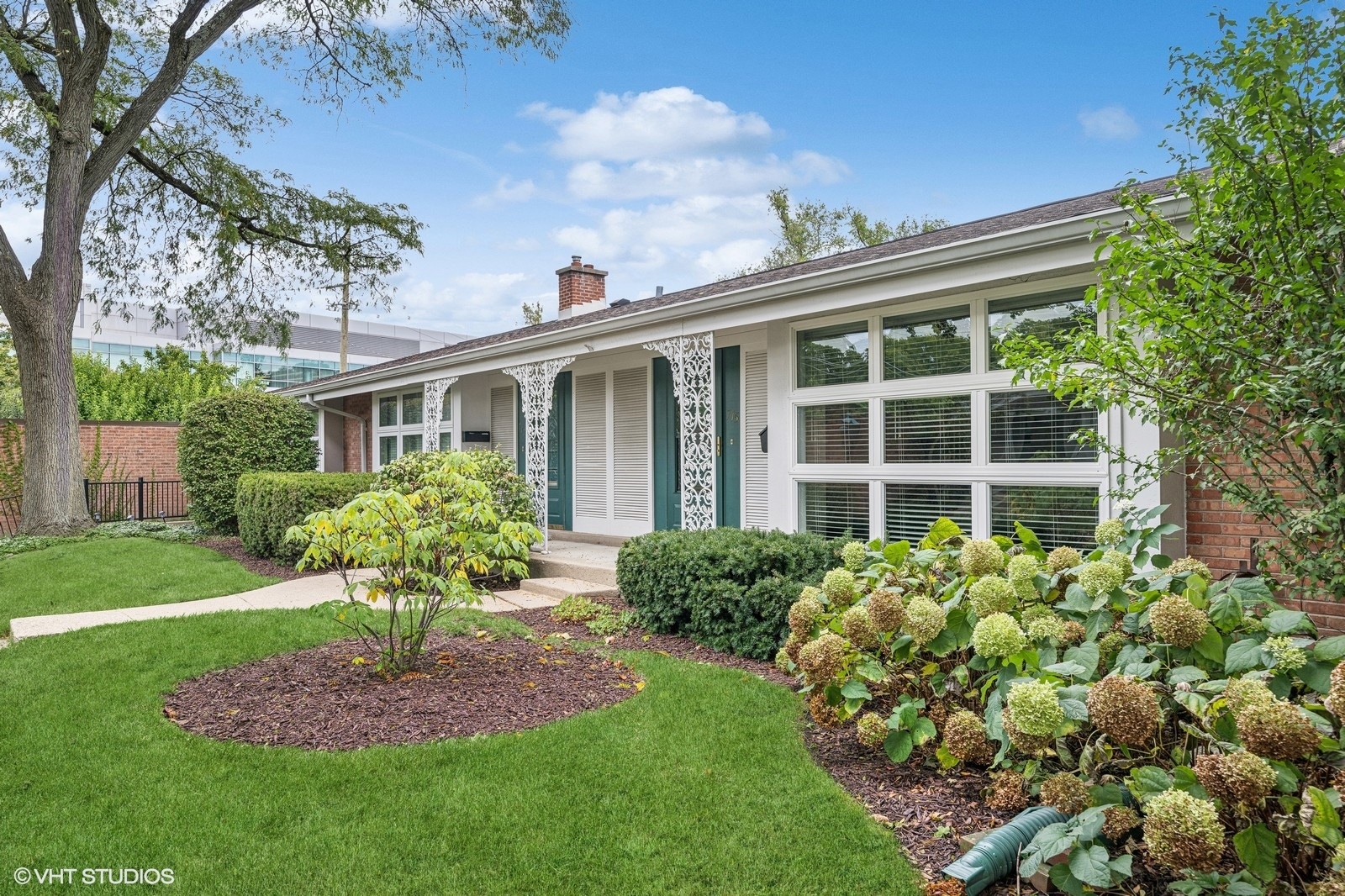 715 Carriage Hill Drive Glenview, IL 60025 - Photo 1 of 18 a front view of a house with a yard