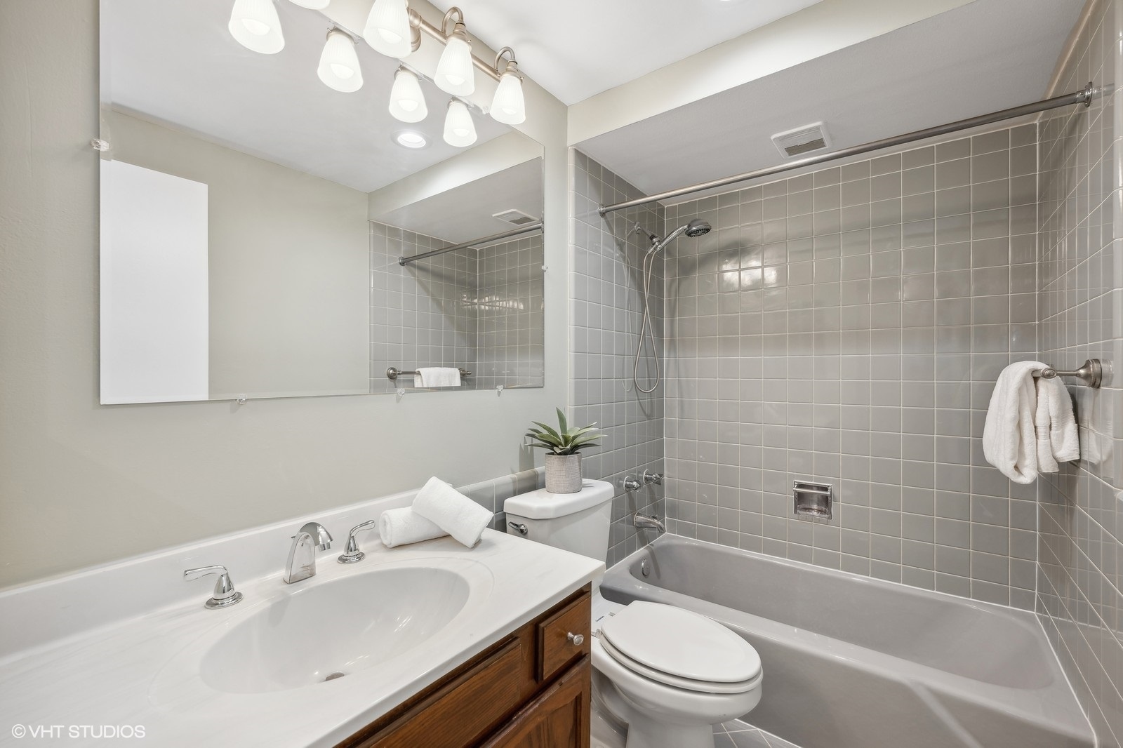 715 Carriage Hill Drive Glenview, IL 60025 - Photo 12 of 18 a bathroom with a sink a toilet and shower