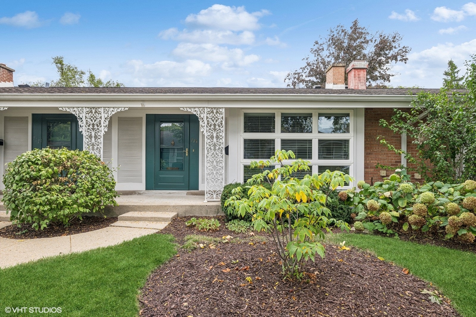 715 Carriage Hill Drive Glenview, IL 60025 - Photo 2 of 18 front view of a house with a yard