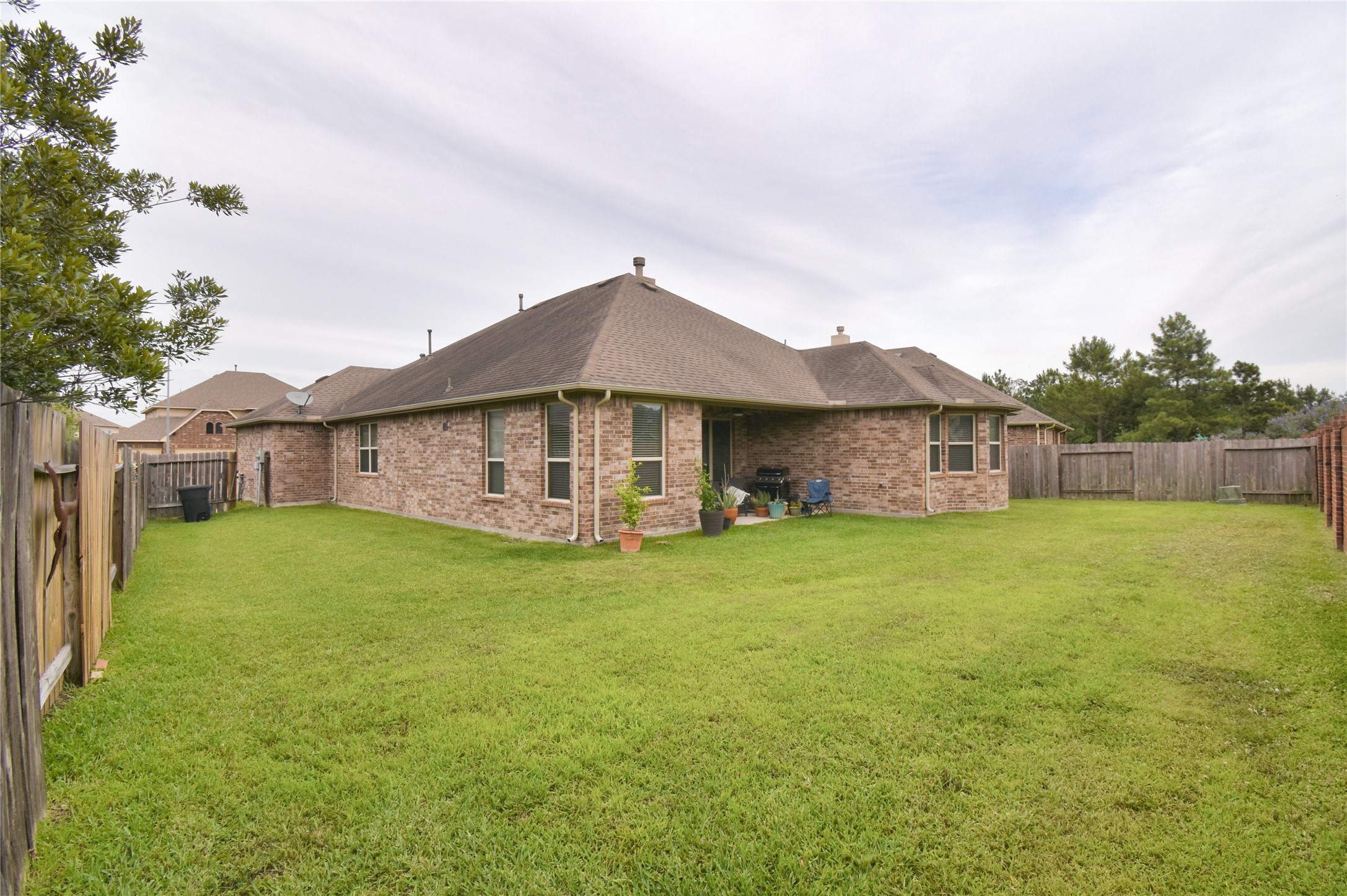 5607 South Denham Ridge Lane Spring, TX 77389 - Photo 36 of 39 a view of a house with a yard