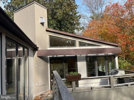 a view of house with outdoor space and porch